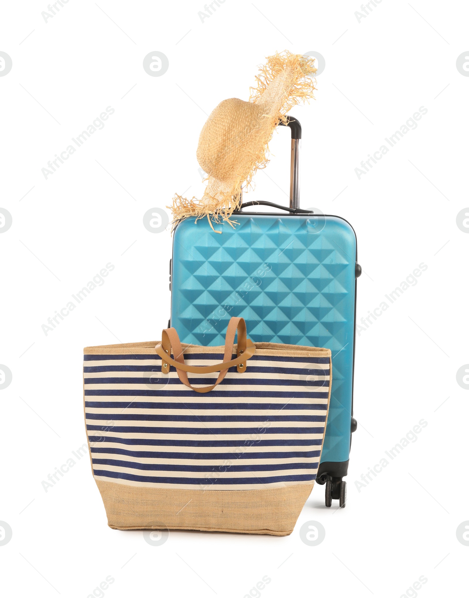 Photo of Light blue suitcase, bag and straw hat isolated on white