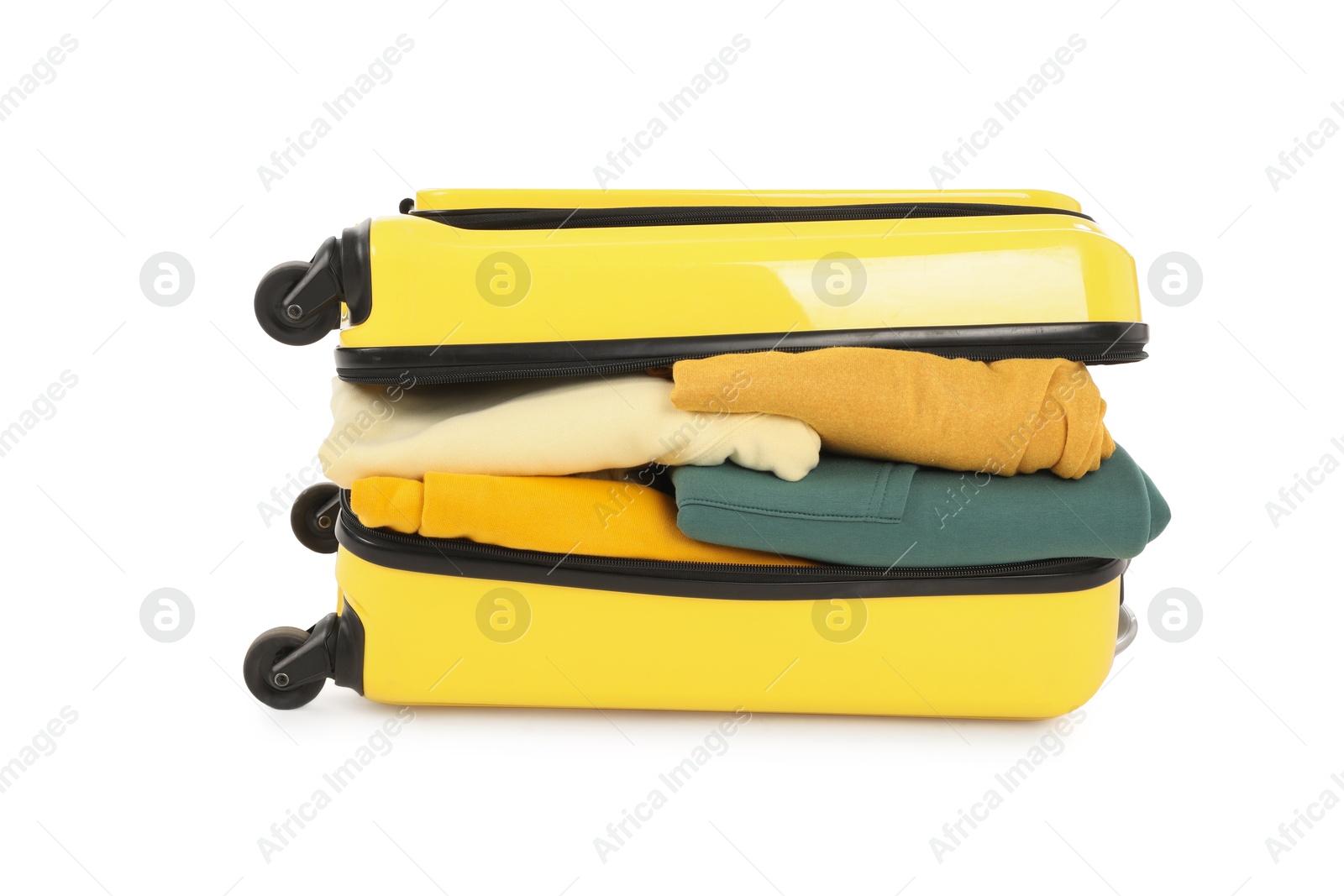 Photo of One new yellow suitcase with clothes isolated on white