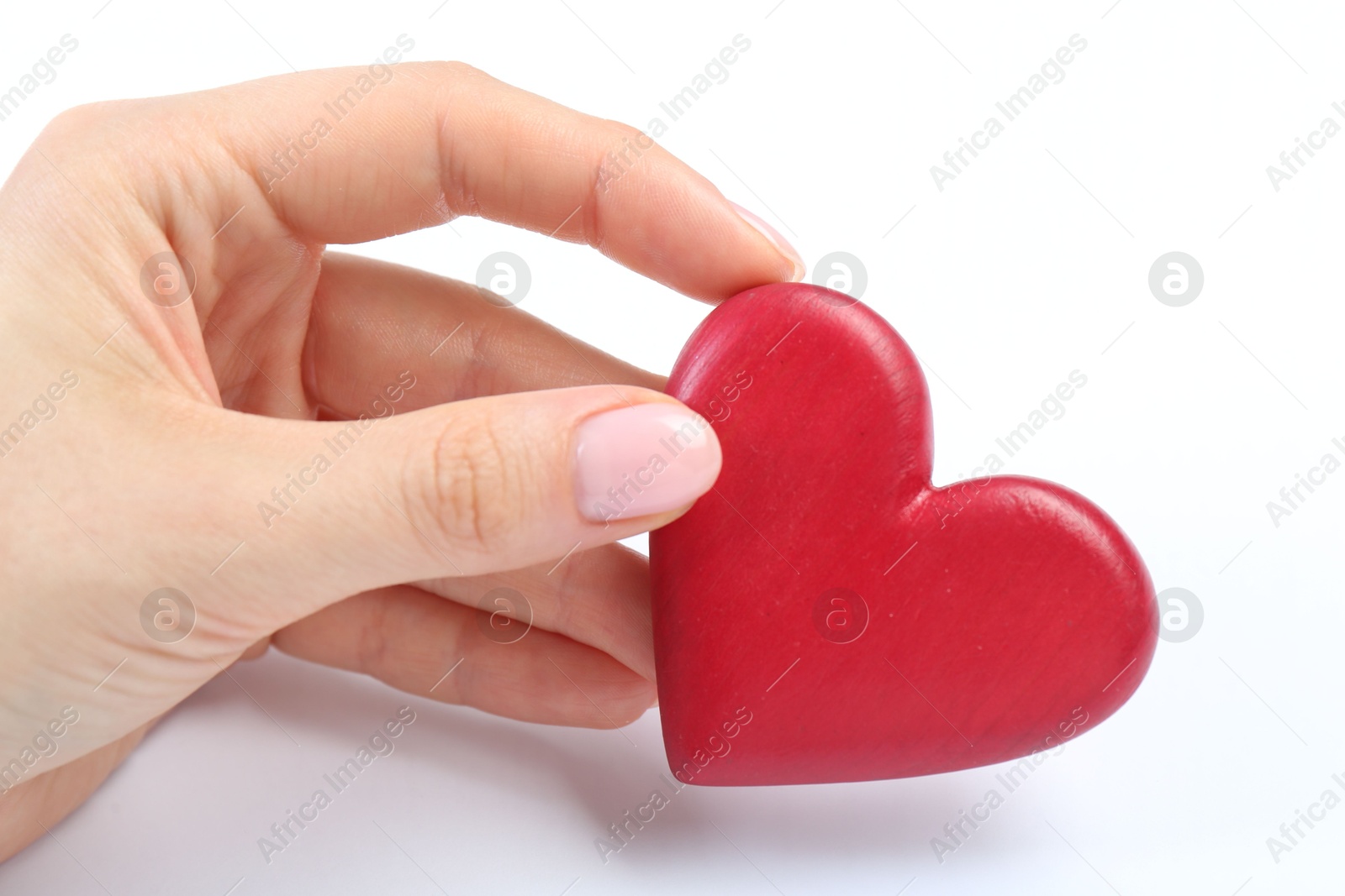 Photo of Woman holding red heart on white background, closeup