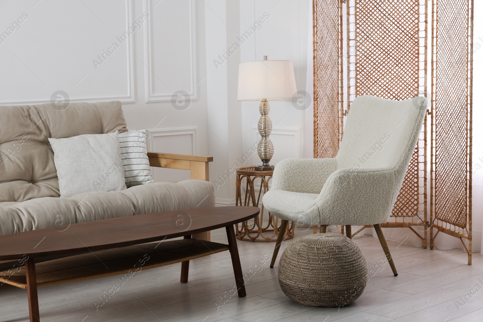 Photo of Folding screen, armchair, sofa and coffee table indoors