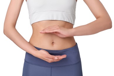 Healthy digestion. Woman holding something near her belly on white background, closeup