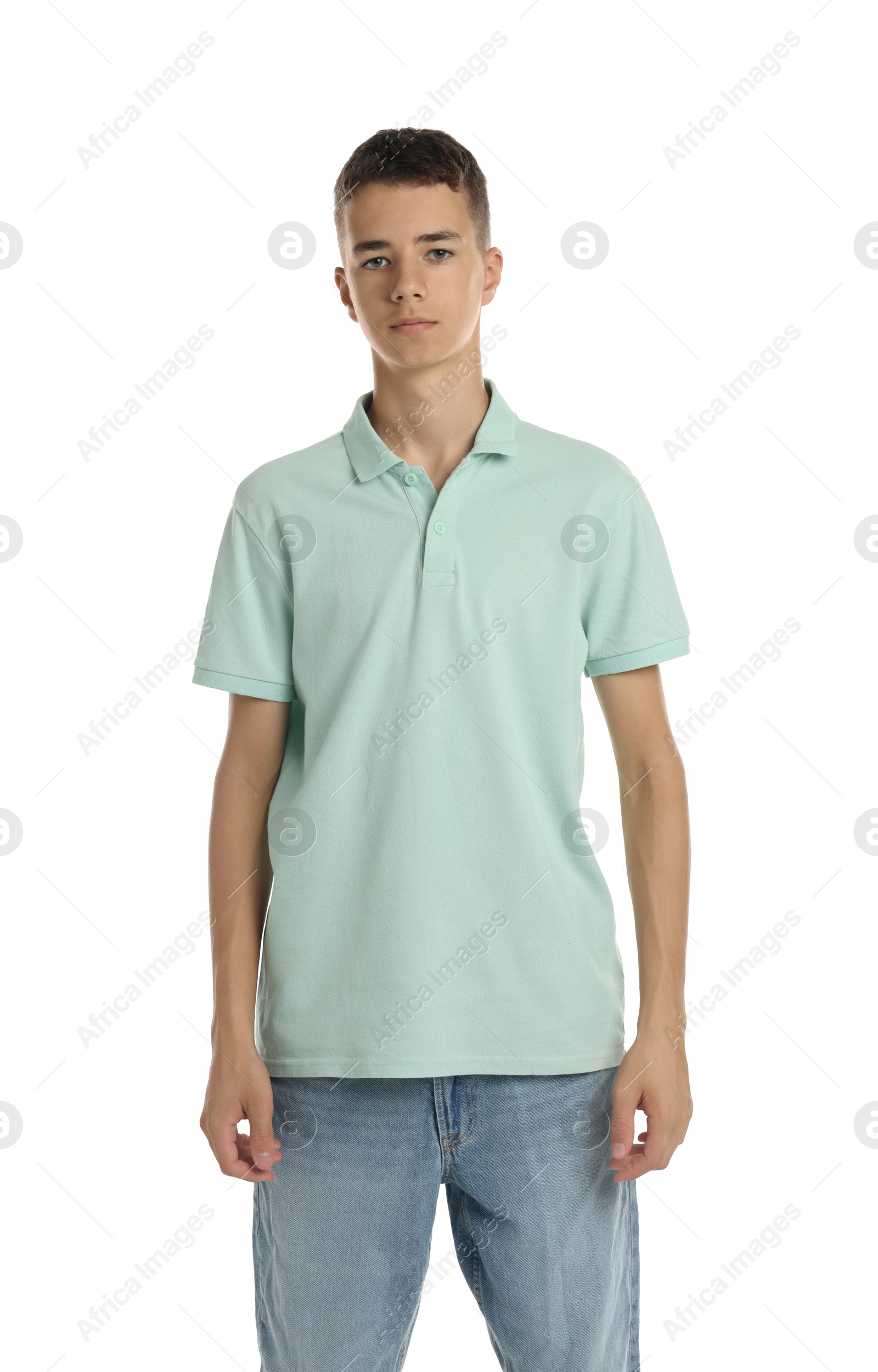 Photo of Teenage boy wearing light green t-shirt on white background