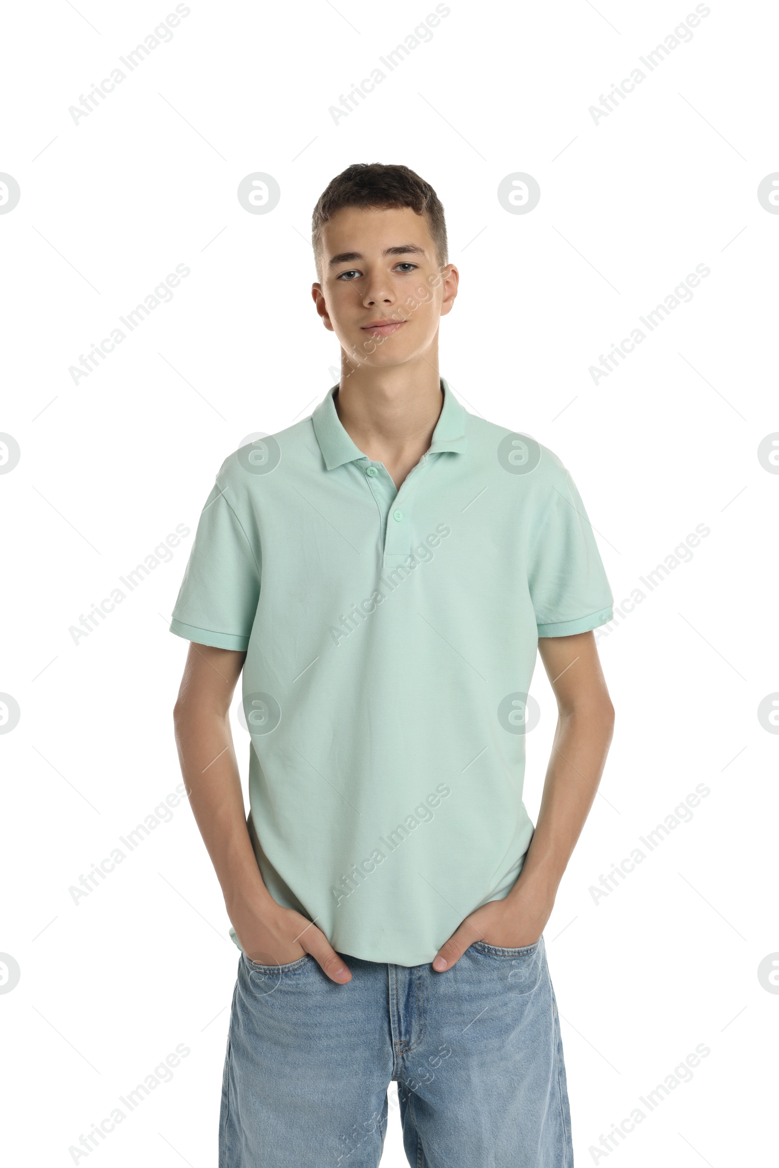 Photo of Teenage boy wearing light green t-shirt on white background