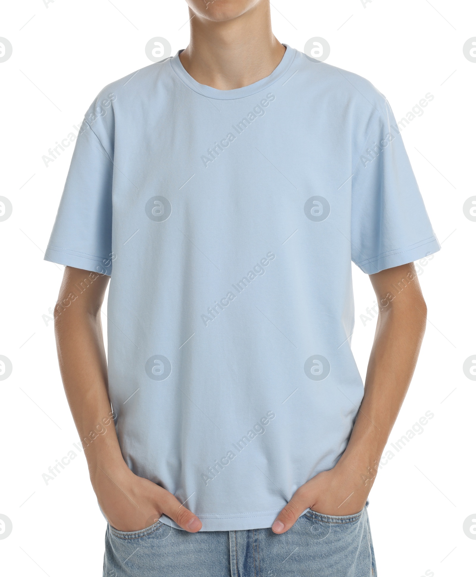 Photo of Teenage boy wearing light blue t-shirt on white background, closeup