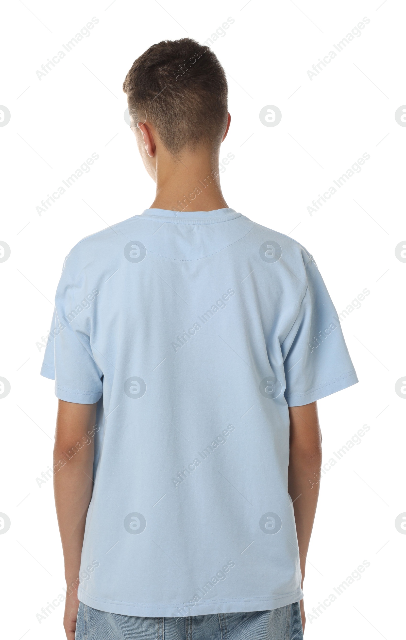 Photo of Teenage boy wearing light blue t-shirt on white background, back view