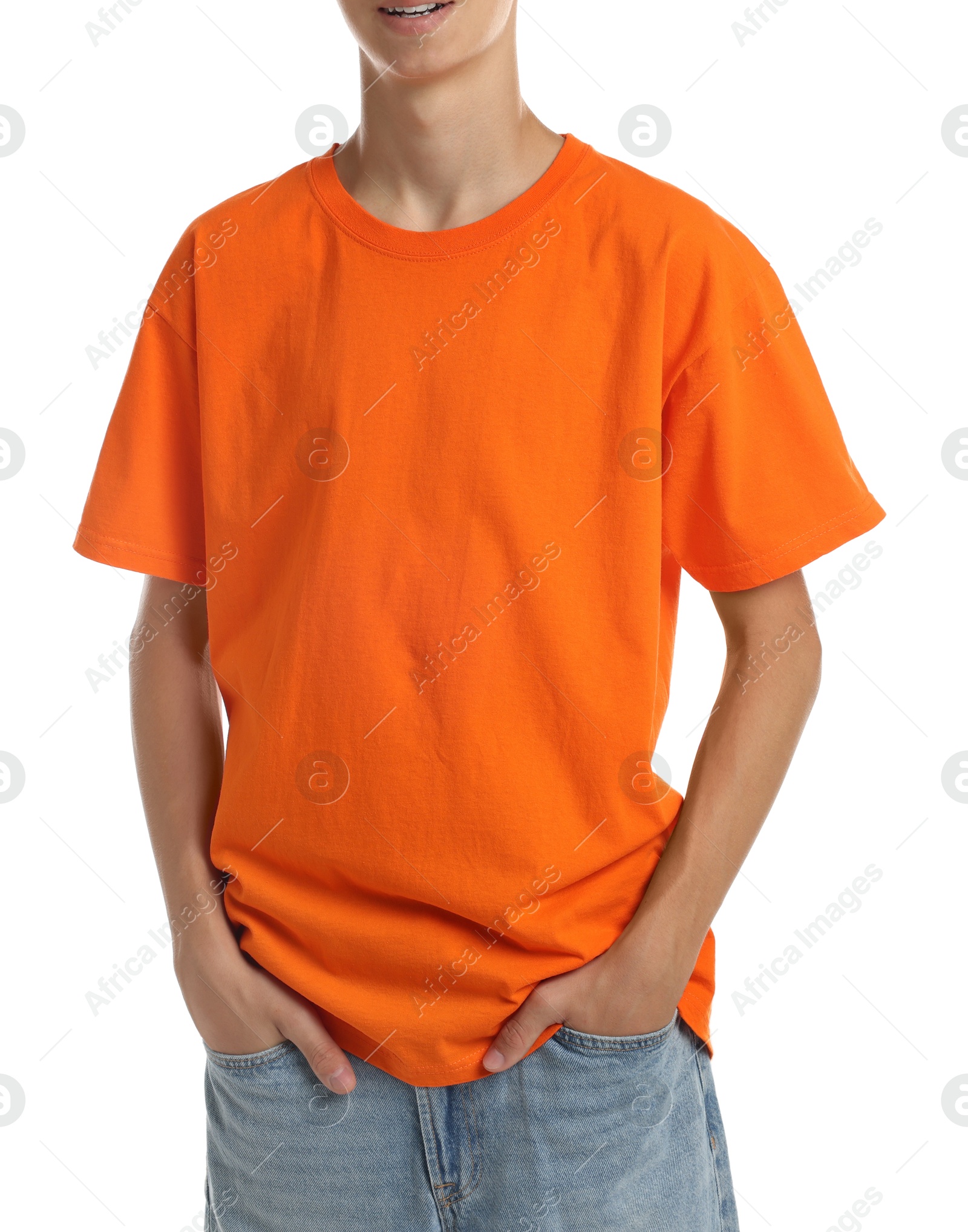 Photo of Teenage boy wearing orange t-shirt on white background, closeup