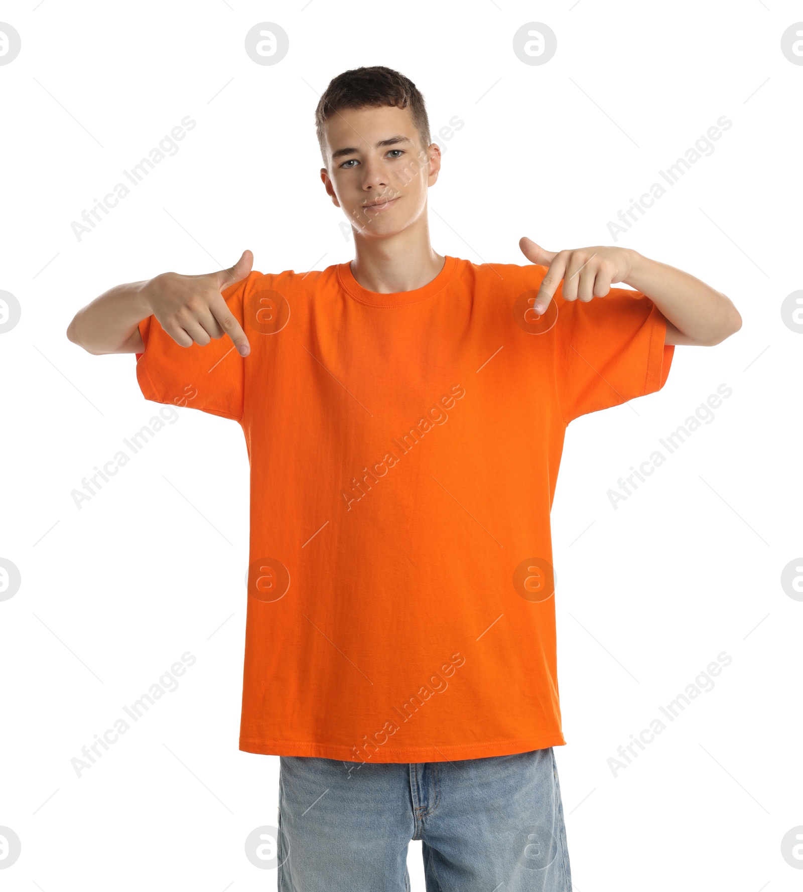 Photo of Teenage boy wearing orange t-shirt on white background