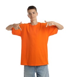 Teenage boy wearing orange t-shirt on white background