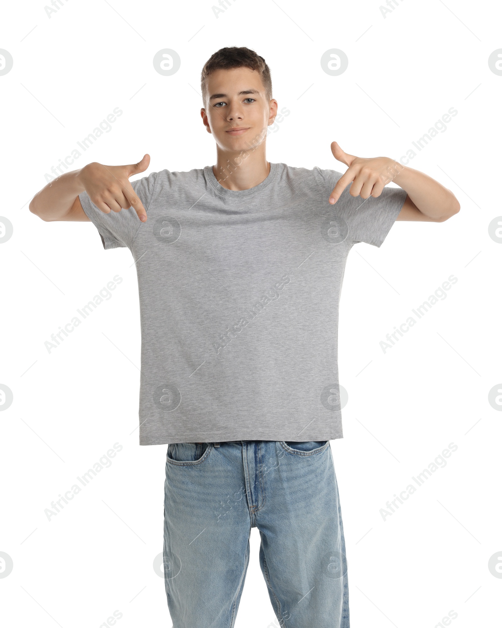 Photo of Teenage boy wearing grey t-shirt on white background