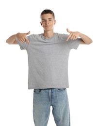 Teenage boy wearing grey t-shirt on white background