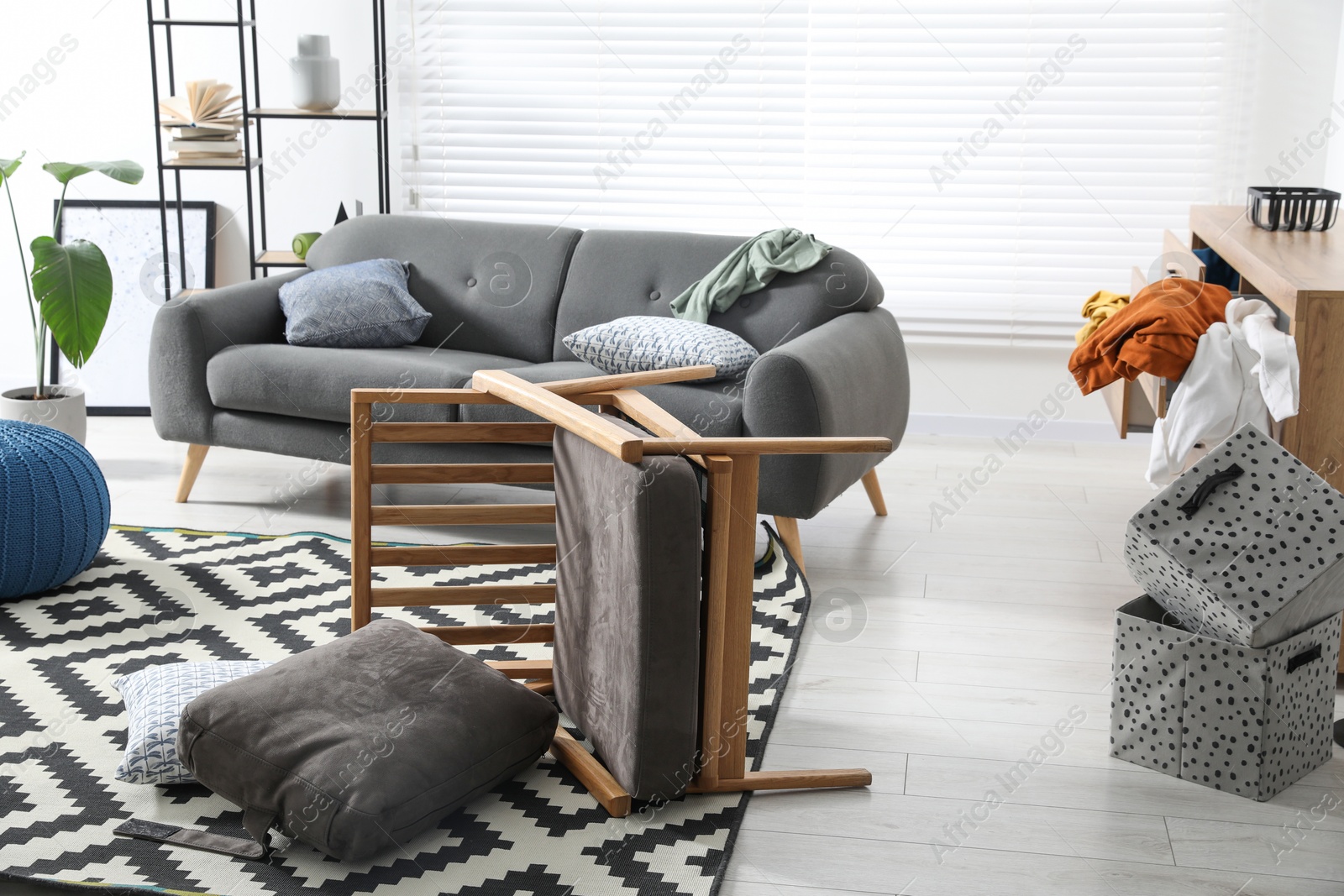 Photo of View on messy living room interior after robbery