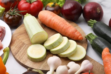 Different fresh vegetables for stew on table