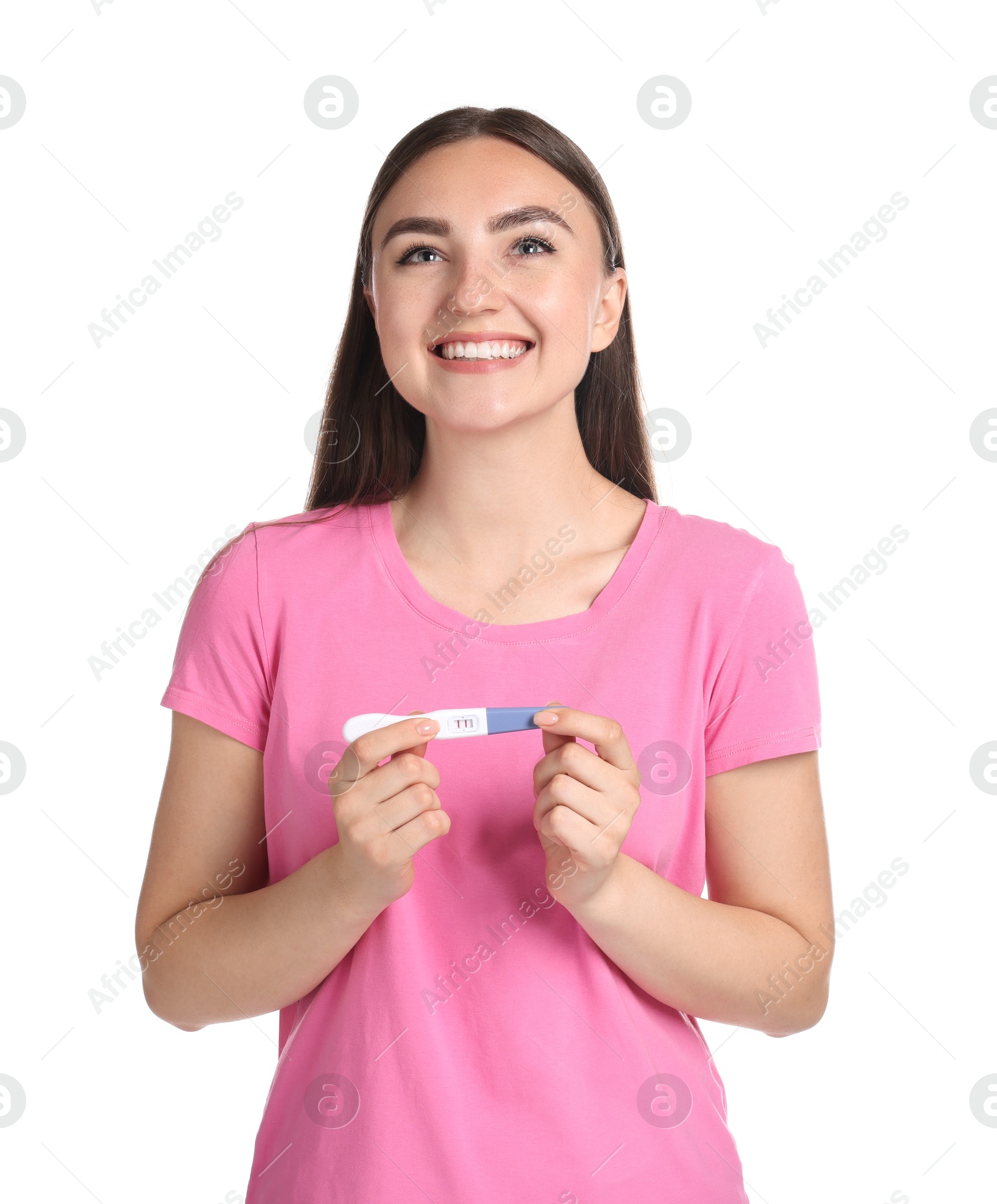 Photo of Happy woman holding pregnancy test on white background