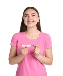 Happy woman holding pregnancy test on white background