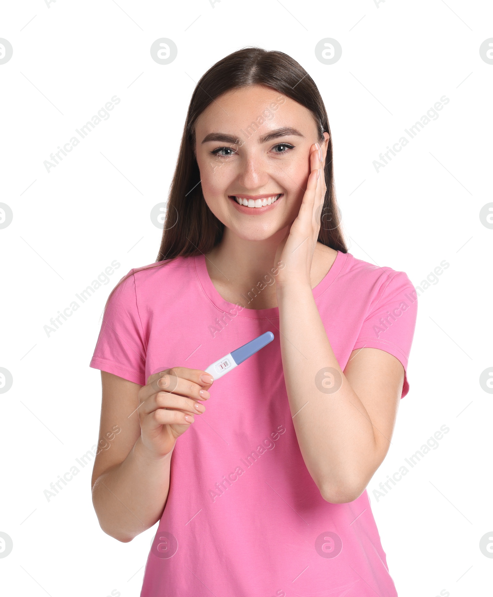 Photo of Happy woman holding pregnancy test on white background