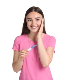 Happy woman holding pregnancy test on white background