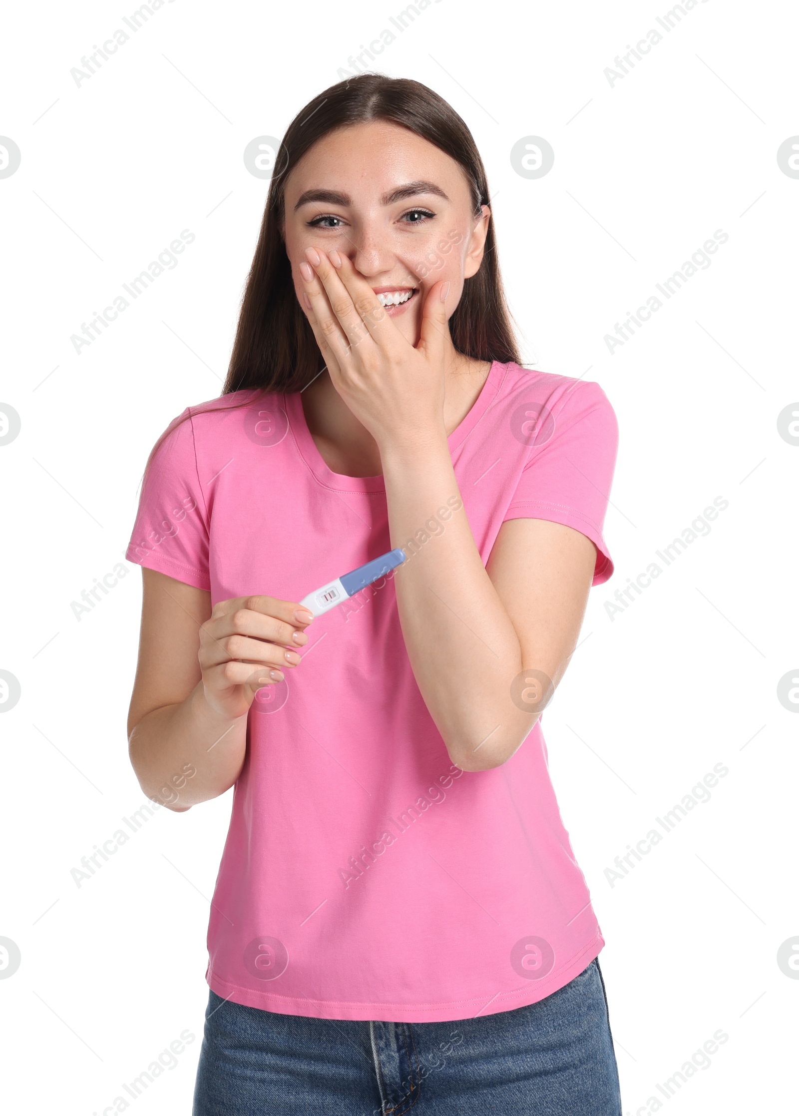 Photo of Happy woman holding pregnancy test on white background