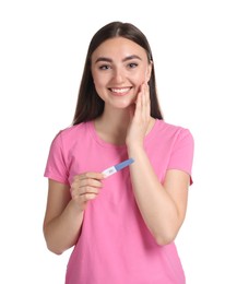 Happy woman holding pregnancy test on white background