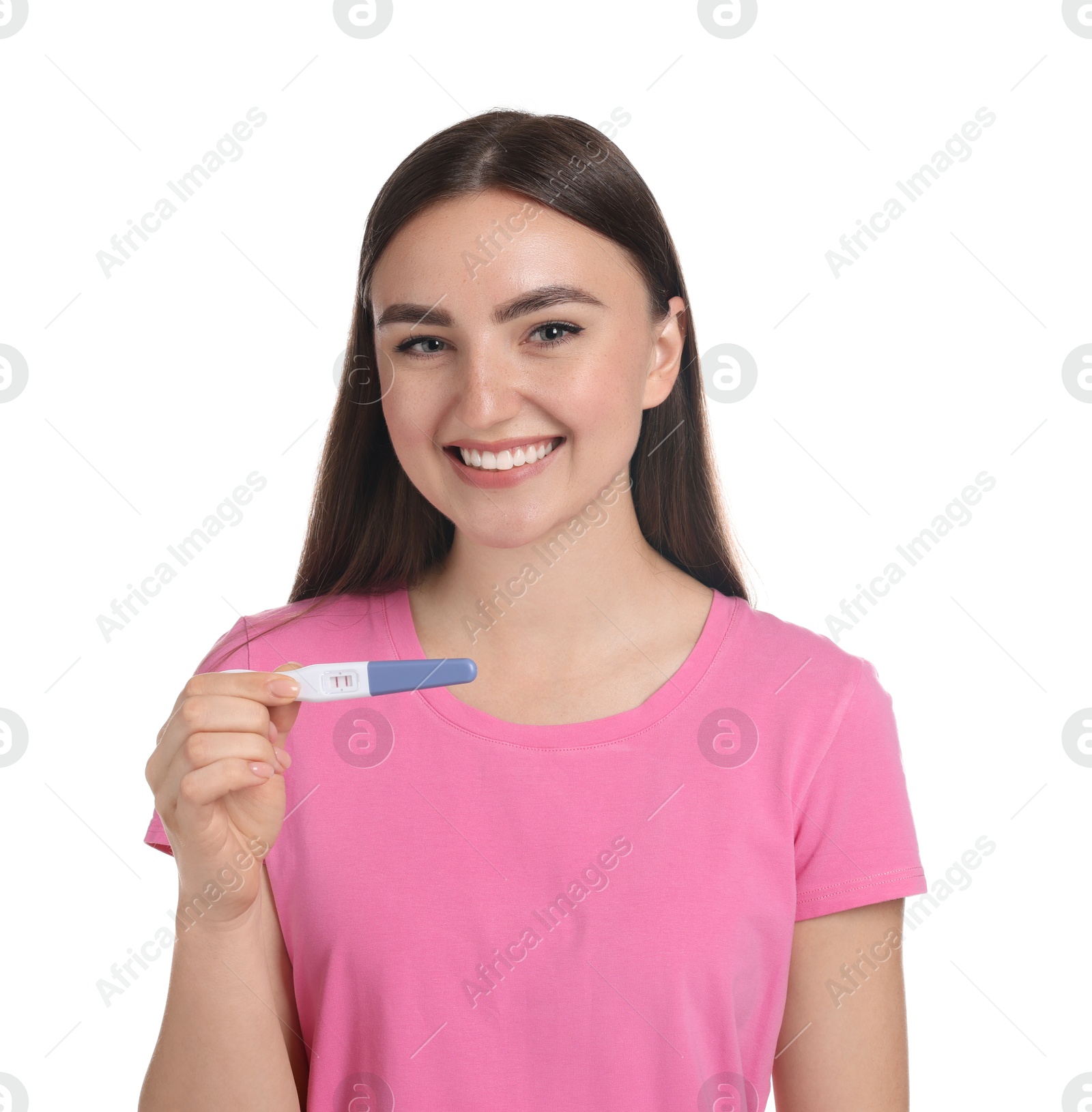 Photo of Happy woman holding pregnancy test on white background