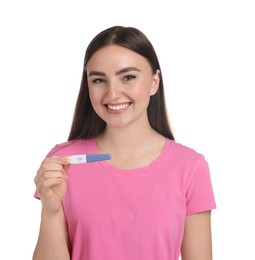 Photo of Happy woman holding pregnancy test on white background