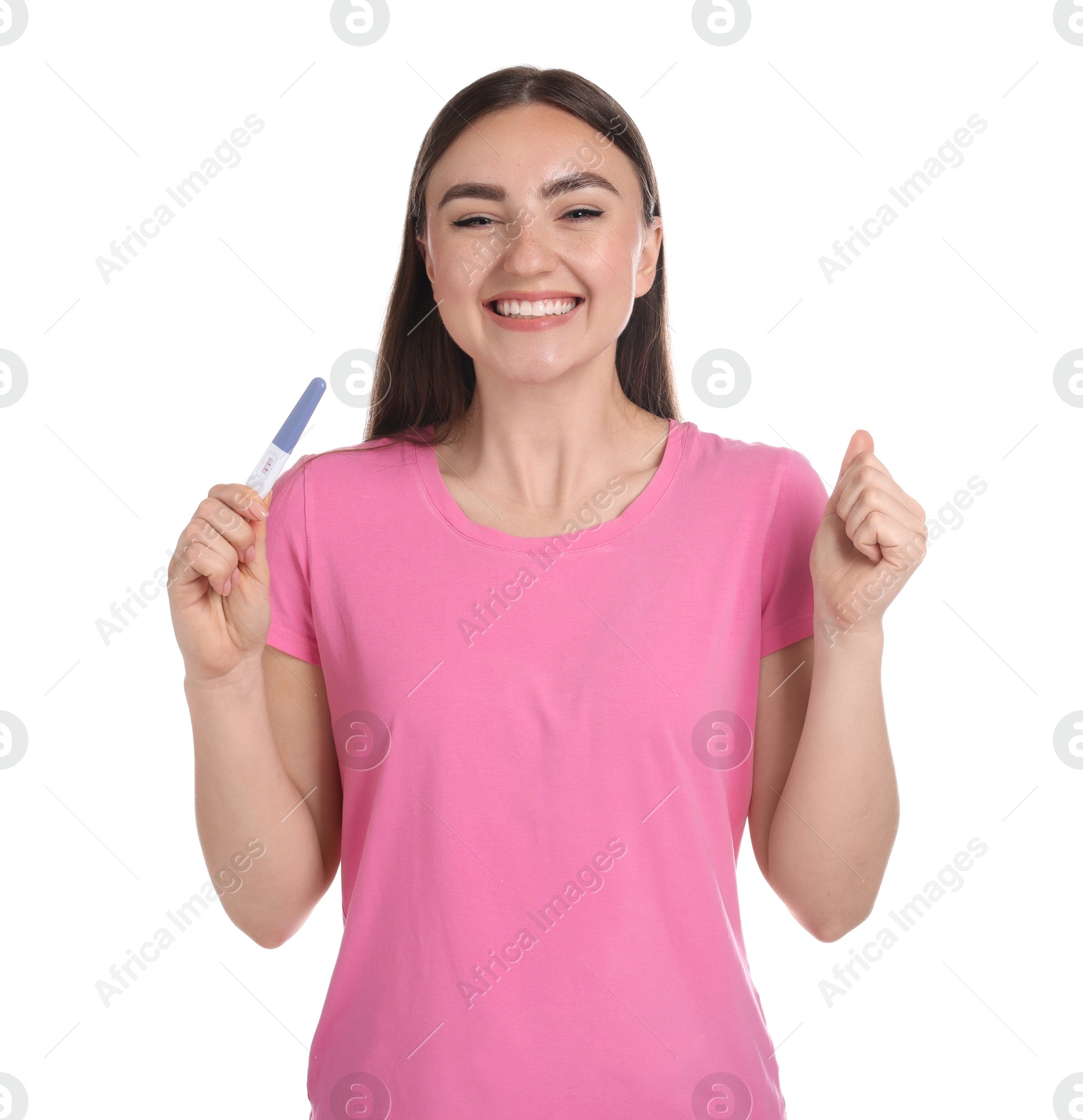 Photo of Happy woman holding pregnancy test on white background