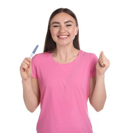 Happy woman holding pregnancy test on white background