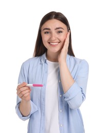 Happy woman holding pregnancy test on white background