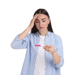 Confused woman holding pregnancy test on white background