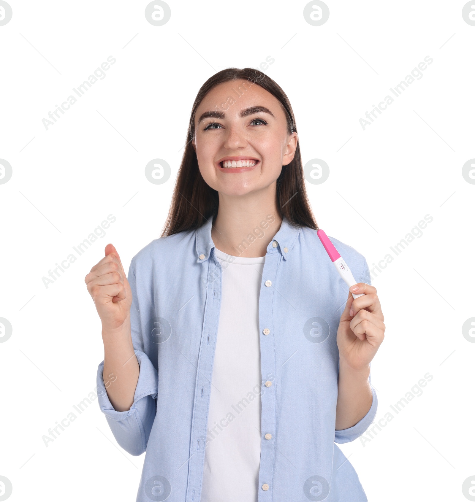 Photo of Happy woman holding pregnancy test on white background