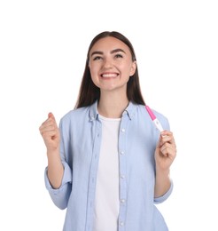 Photo of Happy woman holding pregnancy test on white background