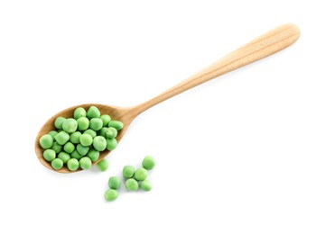 Photo of Spoon with fresh green peas isolated on white, top view