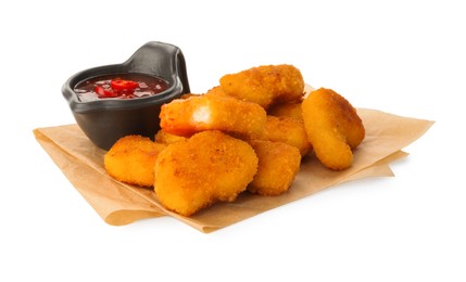 Photo of Hot chili sauce and pile of nuggets isolated on white