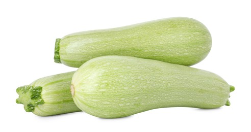 Photo of Many fresh ripe zucchinis isolated on white