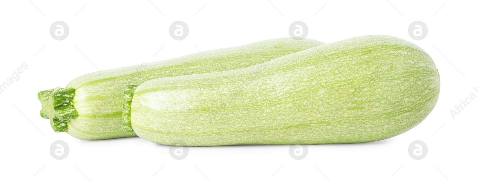 Photo of Two fresh ripe zucchinis isolated on white