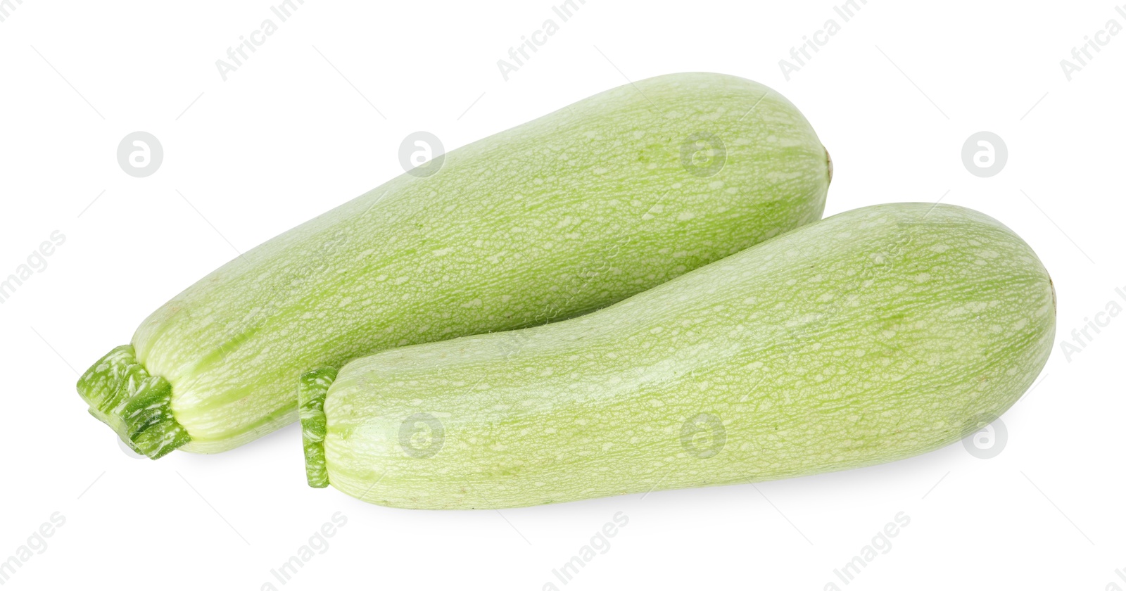 Photo of Two fresh ripe zucchinis isolated on white, top view