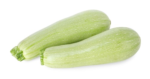 Photo of Two fresh ripe zucchinis isolated on white, top view