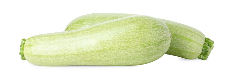 Photo of Two fresh ripe zucchinis isolated on white