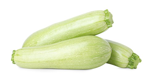 Photo of Many fresh ripe zucchinis isolated on white