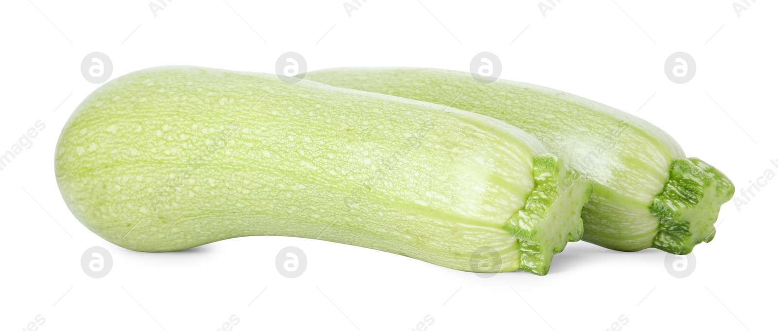 Photo of Two fresh ripe zucchinis isolated on white