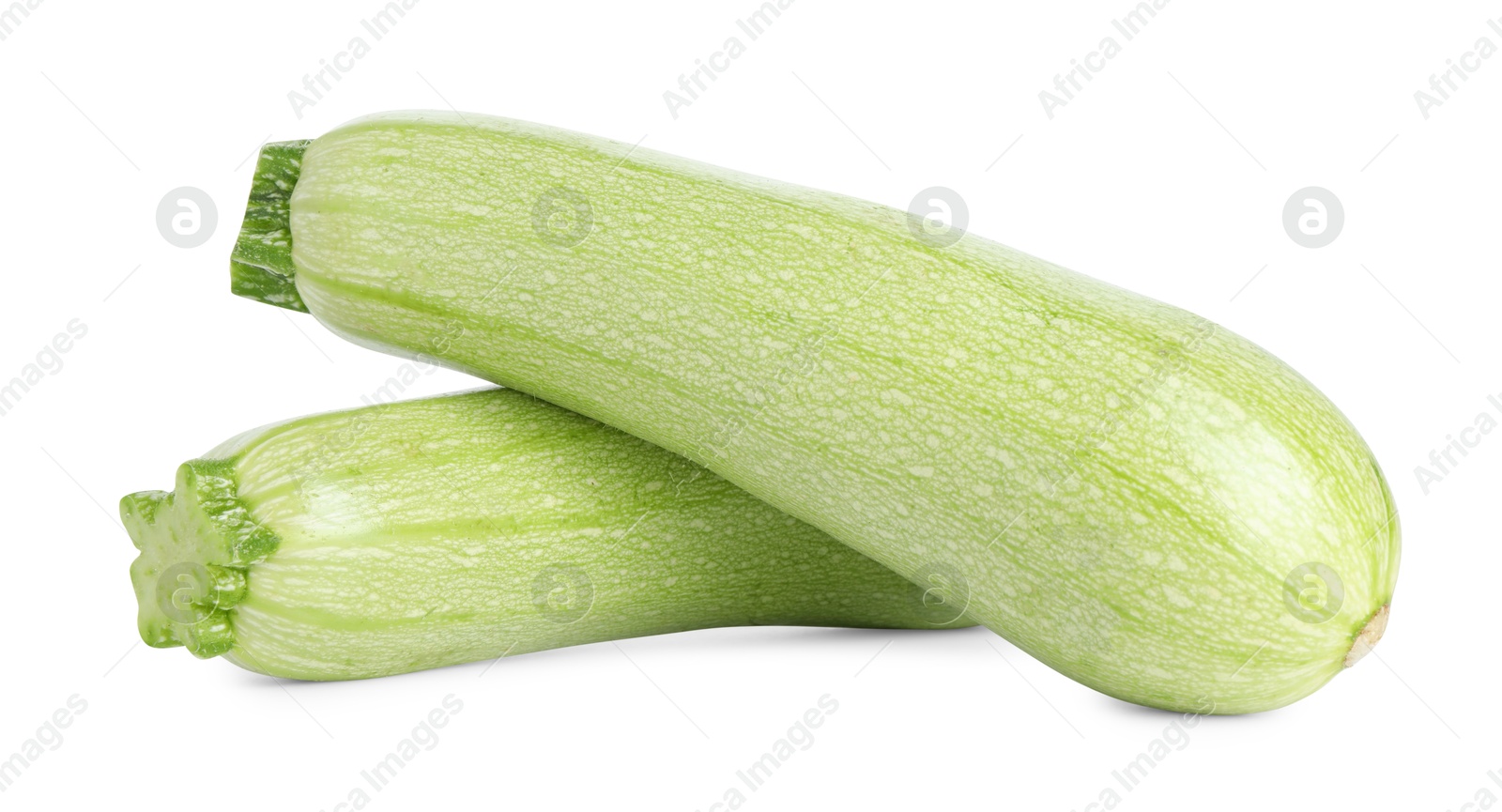 Photo of Two fresh ripe zucchinis isolated on white