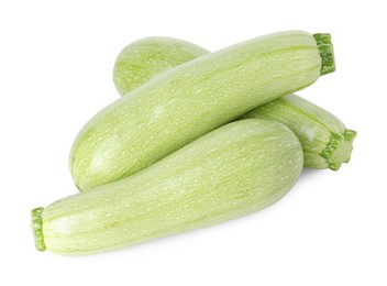 Photo of Many fresh ripe zucchinis isolated on white, above view