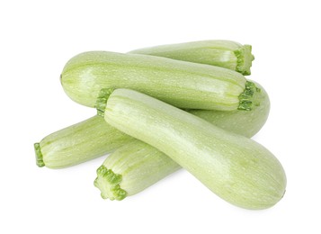 Photo of Many fresh ripe zucchinis isolated on white, above view