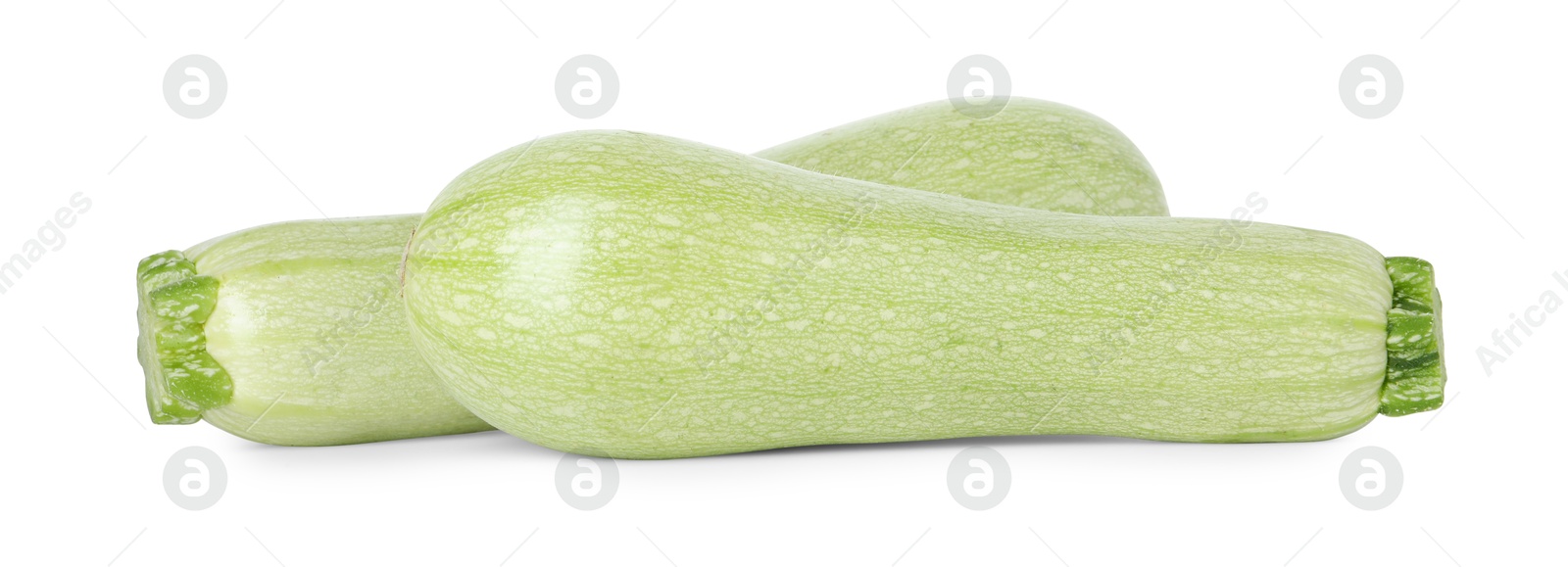 Photo of Two fresh ripe zucchinis isolated on white