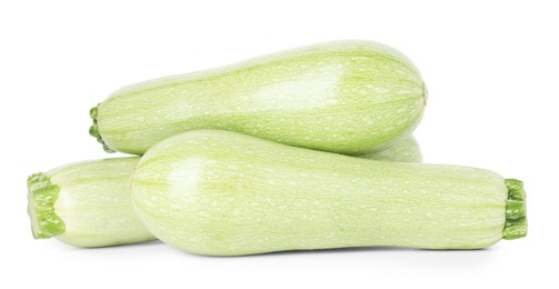 Photo of Many fresh ripe zucchinis isolated on white