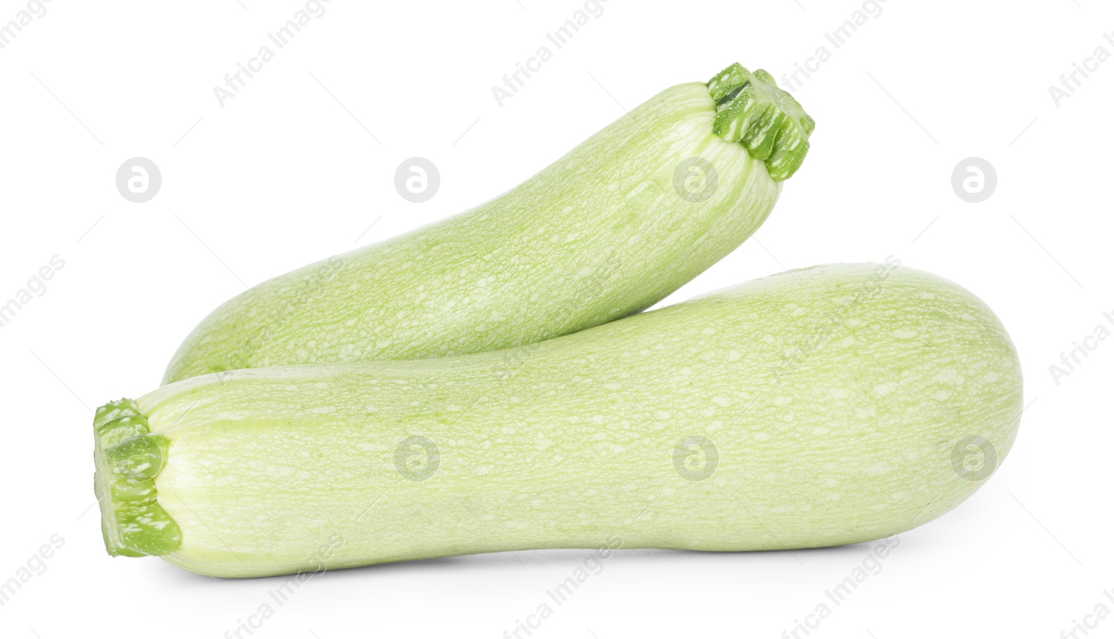 Photo of Two fresh ripe zucchinis isolated on white