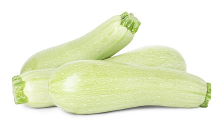 Photo of Many fresh ripe zucchinis isolated on white