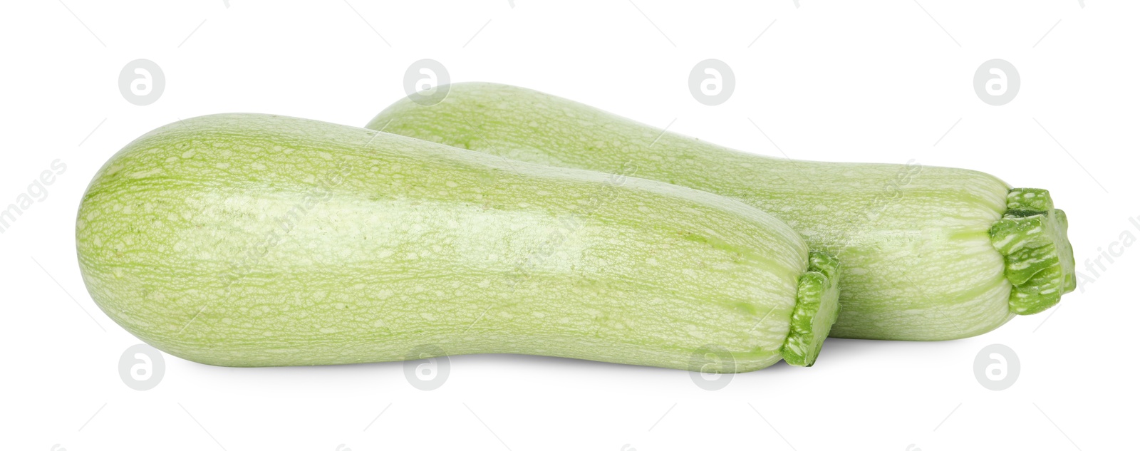 Photo of Two fresh ripe zucchinis isolated on white