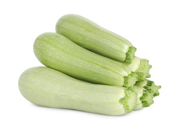 Photo of Many fresh ripe zucchinis isolated on white