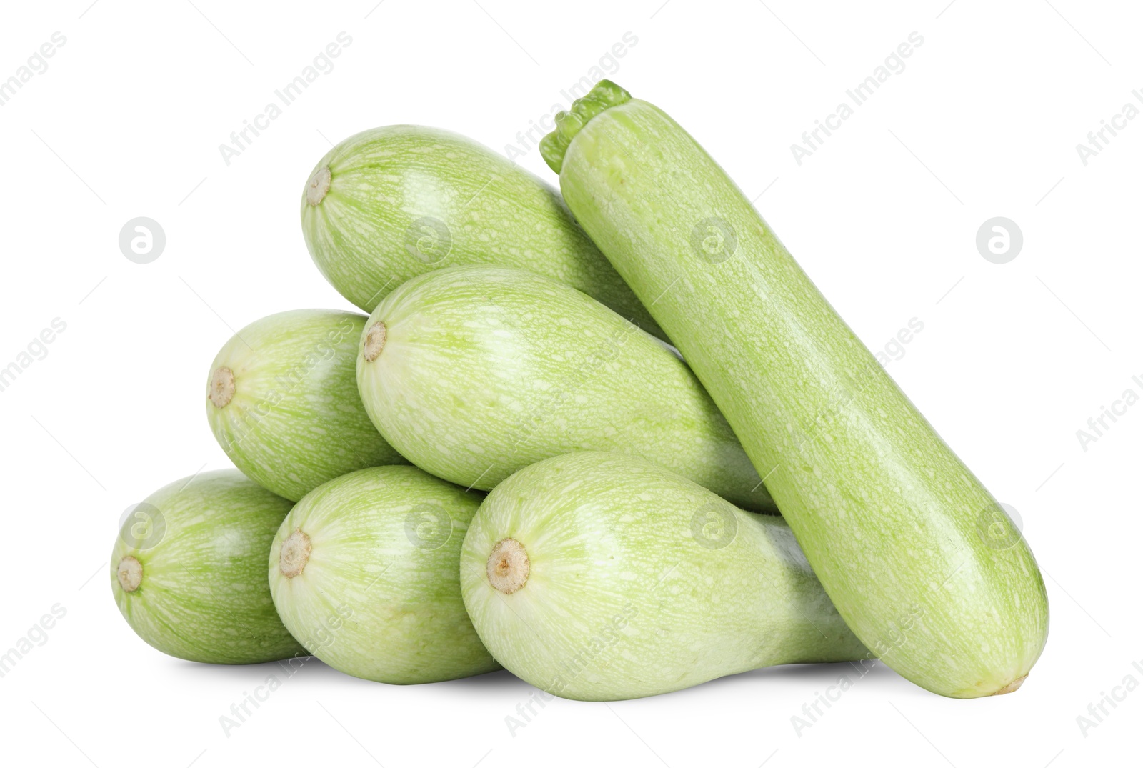 Photo of Many fresh ripe zucchinis isolated on white