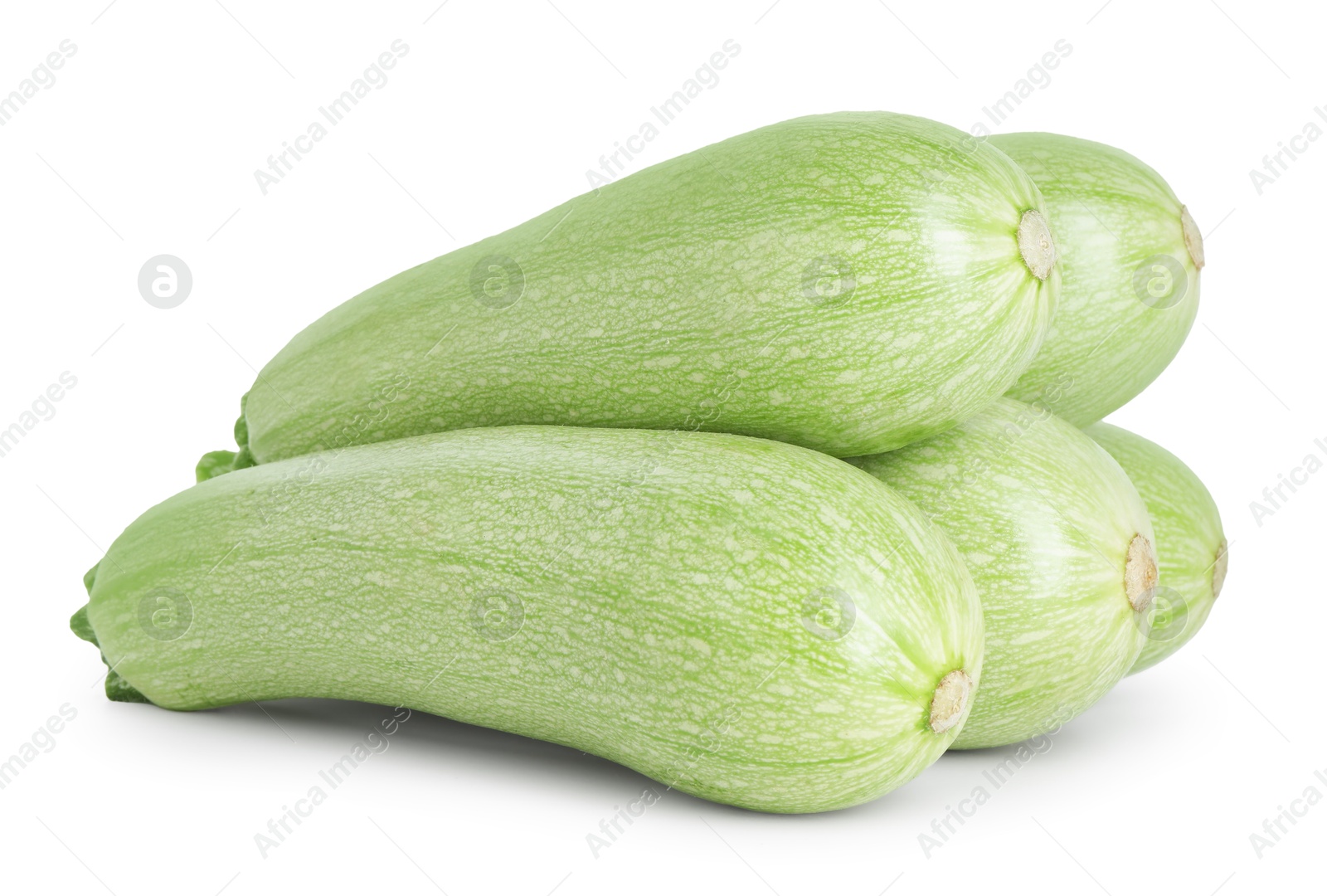 Photo of Many fresh ripe zucchinis isolated on white